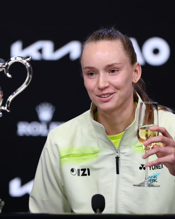 Elena Rybakina drinking champagne in her Australian Open Champions press conference.